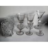 Three 18th century wrythen drinking glasses, 11, 10, 8 cm; a pair of 19th century cut-glass