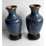 A pair of Chinese cloisonné vases on stands with blue floral pattern, each 18 cm H without damage or