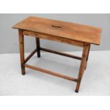 A 19th century elm oblong stool with stretcher supports, 52 x 72 x 30 cm