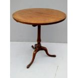 A Georgian mahogany circular tripod table, 70 H x 61 cm diameter