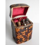 A Victorian tortoise shell and ivory etui with hinged cover, fitted interior, silver cartouche to