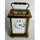 A French brass carriage clock with Roman numerals, in working order but not keeping time, 11cm H