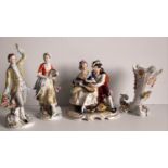 A Rudolf Kammer porcelain figurine of a seated couple, a pair of Sitzendorf figurines, all without