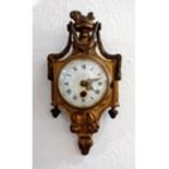 A 19th century French ormolu cartel clock, enamel dial with Roman numerals, maker's name rubbed,