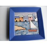 A pair of hand-decorated square ceramic wall plaques with multi-coloured seashore decoration, 32cm