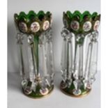 A pair of 19th century Bohemian overlaid green glass lustre vases decorated with oval medallions