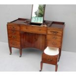 A Georgian mahogany gentleman's cabinet/dressing table, in the manner of Gillows, with two-piece