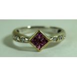 A diamond and pink gem set ring, to a white metal mount, stamped 750, weight 2.