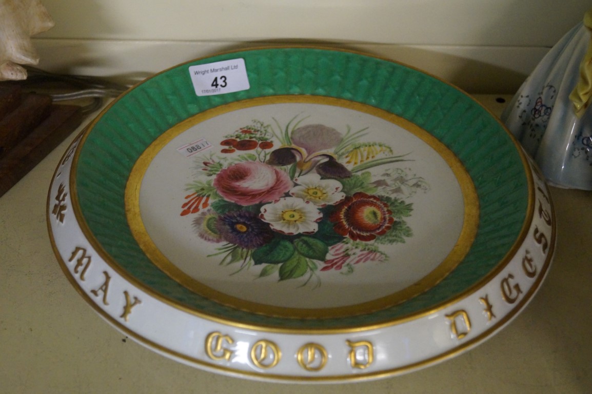 A 19th century continental bread plate having hand painted floral decoration with Italian motto to