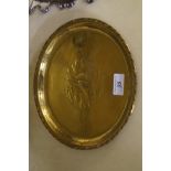 A Harold Holmes Arts & Crafts style brass charger having planished decoration of a galleon.