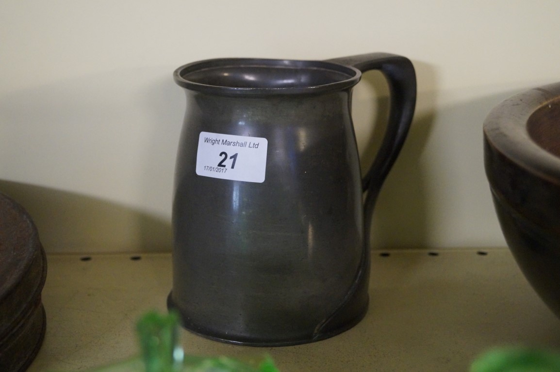 An Arts & Crafts tudoric pewter tankard, impressed number 066.