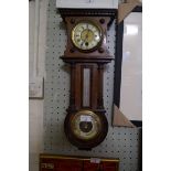 An Edwardian mahogany clock barometer with Junghans clock movement.