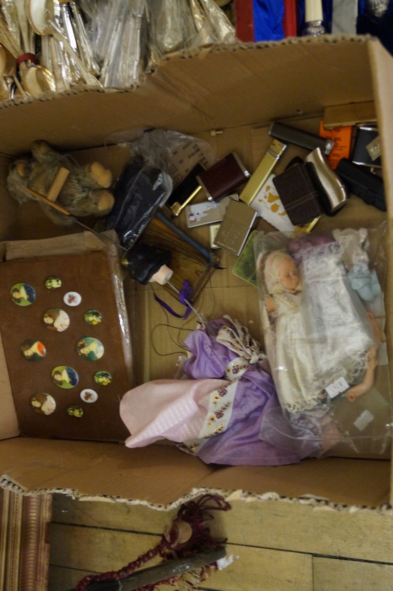 A mixed lot to include an assortment of vintage lighters, dolls etc.