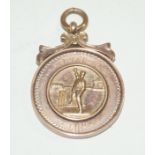 A 9ct gold Cricketing Prize medal Awarded to T. Marsden by the Phoenix Works, approx weight 8.8gms.