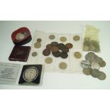 A collection of coins to include a silver United States of America dollar,