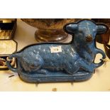 A vintage blue enamel mould in the form of a seated lamb.