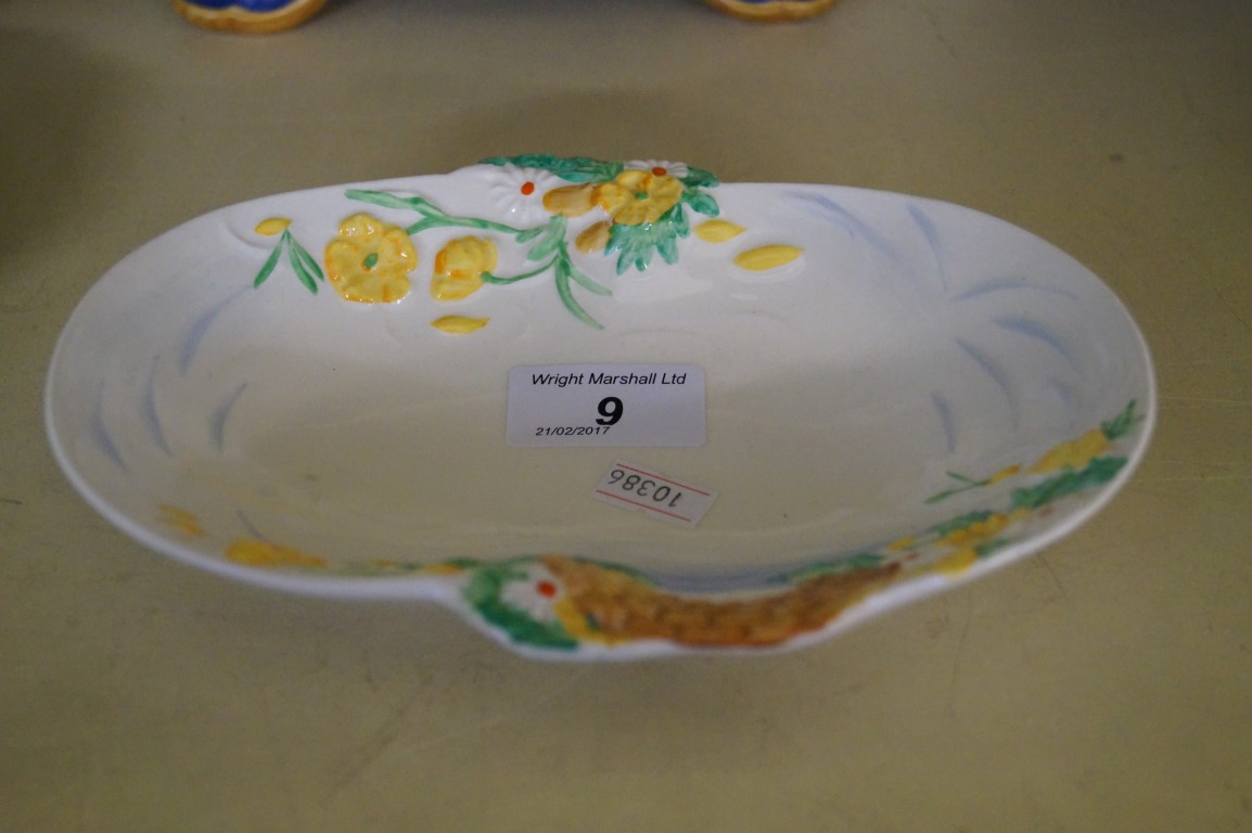 A Clarice Cliff oval bowl having relief decoration.