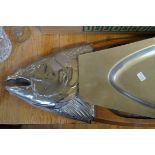 An unusual chopping board in the form a fish,