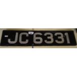A vintage metal registration plate JC6331