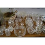 A good assortment of cut and other glassware to include jug, vases, dressing table set etc.