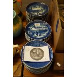 A large collection of Royal Copenhagen Christmas plates.
