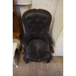 A mid 19th Century mahogany show wood nursing chair, with carved curved arms,