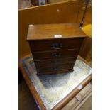 A mahogany miniature straight front chest of three drawers having one dummy drawer.