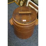 A large salt glazed twin handled biscuit barrel with wooden cover.