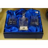 A Royal Scott crystal three piece travelling drink set, each piece engraved with golfing scenes,