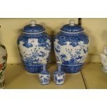Four pieces of Chinese blue and white to include two lidded jars and two smaller vases.