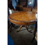 A good quality reproduction circular topped library table raised splay supports