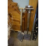 Two wood handled shovels and a wooden handled spade.