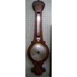 A Victorian mahogany banjo barometer.