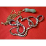 A Jadeite jade pendant and yellow metal chain, together with,