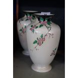 A pair of 20th Century Shelley lustre vases having floral decoration.