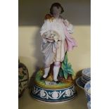 A 19th Century Parian ware figural lamp base modelled in the form of a gentleman in landscape scene,