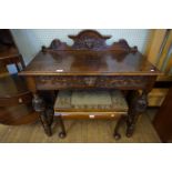 An early 20th Century Victorian style oak hall table with single carved drawer.