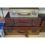 Five vintage suitcases of various sizes and materials, to include leather and pig skin.