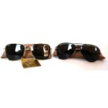 Two pairs of vintage Ray-Ban Bausch & Lomb sunglasses To include a pair of gold framed Caravan
