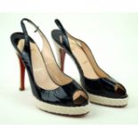 Christian Louboutin: A pair of black patent leather peep toe sling back heeled shoes Size 39,