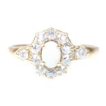 An early 20th century opal and diamond cluster ring The oval-shaped precious opal to an old-cut