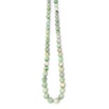 A jadeite jade bead necklace The graduated beads, from approximately 4.75mm to 8.