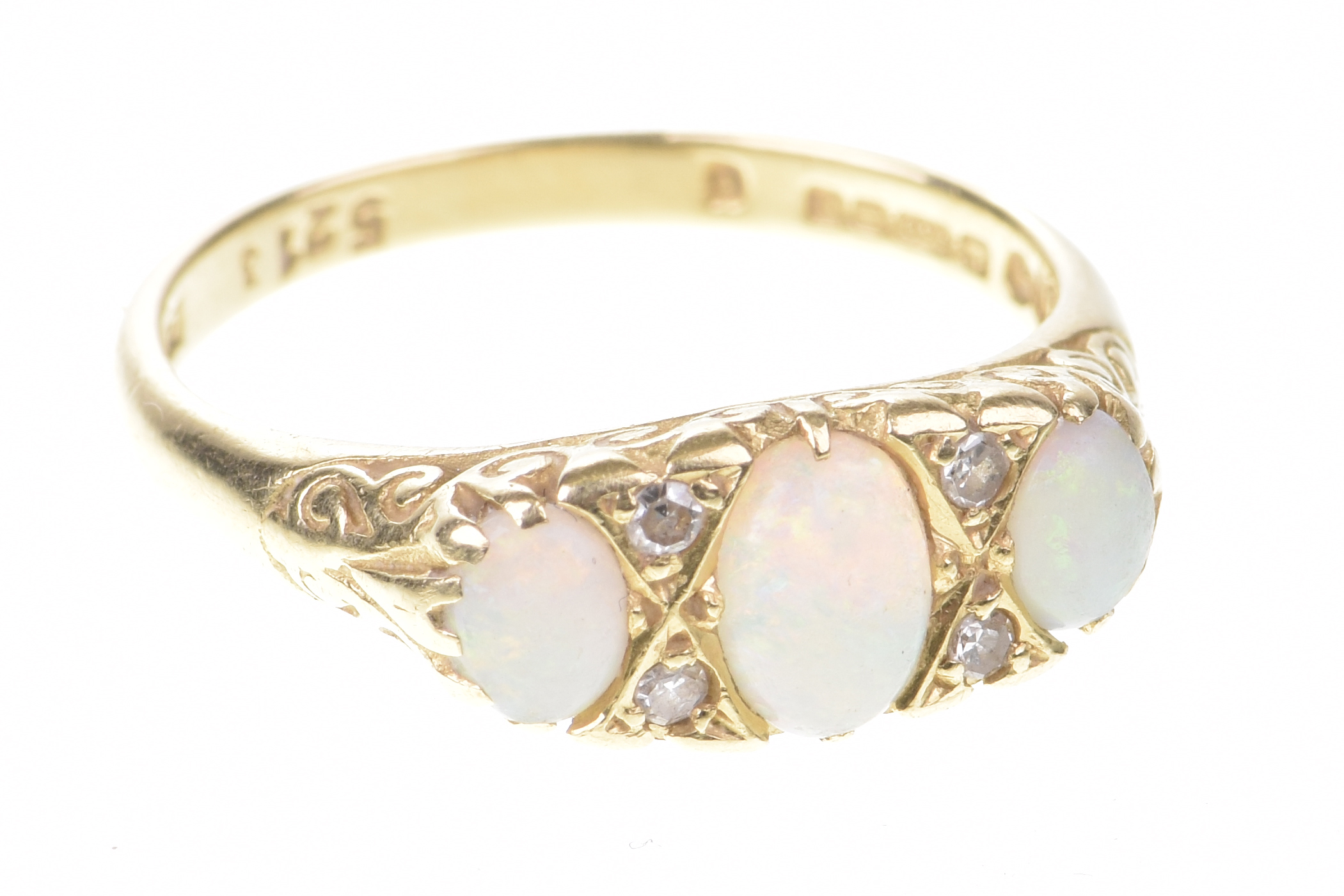 An opal and diamond ring The three graduated oval cabochon opals interspaced by old-cut diamonds,