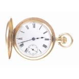 An 18ct gold half hunter key wind pocket watch The white enamel dial with black Roman numerals,