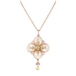 An Edwardian peridot and seed pearl necklace Of quatre-foil open work design,