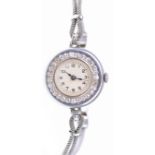 An Art Deco 9ct white gold and diamond set Ladies cocktail watch The white circular dial,