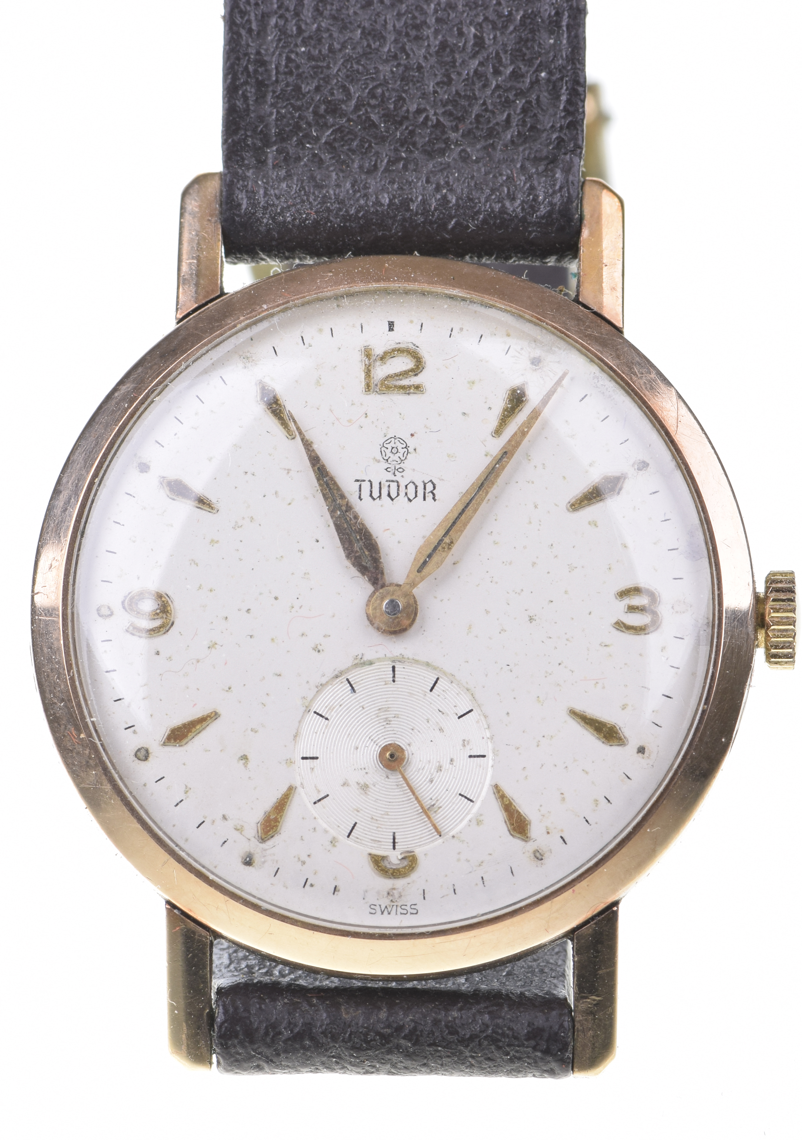 Tudor: A 9ct gold manual wind wristwatch The circular white dial,