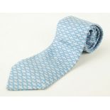 An Hermes silk tie The very pale blue ground, with a dark blue repeating 'H' pattern,