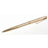 Parker: A 9ct gold pen With ridged shaft and engine turned decoration, vacant cartouche,