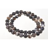 An agate bead necklace Comprising a series of forty-three spherical agate beads,